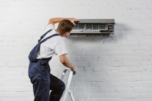 A Professional Technician. installing a new AC Unit