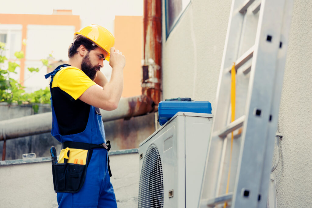 A professional technician installing a new Heat Pump